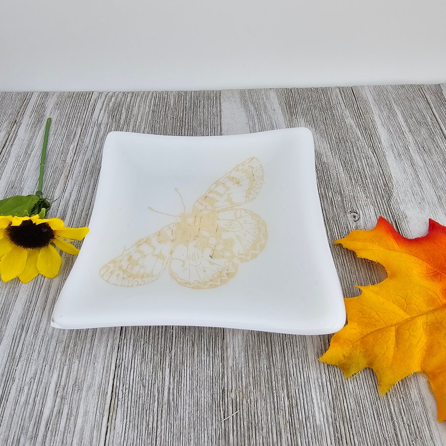 butterfly dish. Screen printed butterfly in a copper color, fused fully into the glass. No fading or scratching of the image as its part of the glass. Food safe.