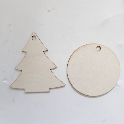 Two wooden cutout ornaments, one round and one tree-shaped.  Small 2.75" ornament bases.