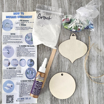Craft kit with wooden ornaments, tacky glue, and instructions.  Complete kit to create 2 small 2.75" ornaments.