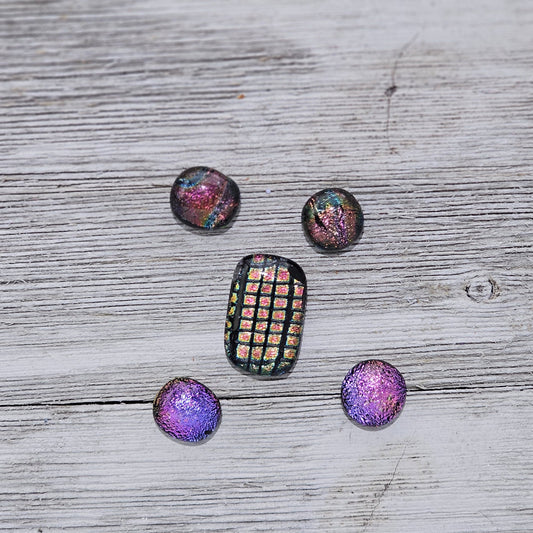 Lot of 5 dichroic glass pieces: Four pieces approx. 0.5"x0.5" and one 1"x0.5", all handmade and topped with clear glass for extra sparkle. The pieces have an organic shape due to their handmade nature. Dots come in an organza bag.