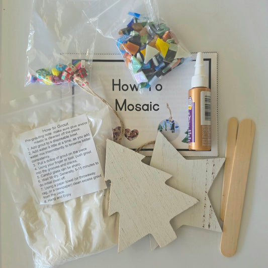 Craft kit with wooden ornaments, tacky glue, and instructions.  Complete kit to create 2 large 4" ornaments.
