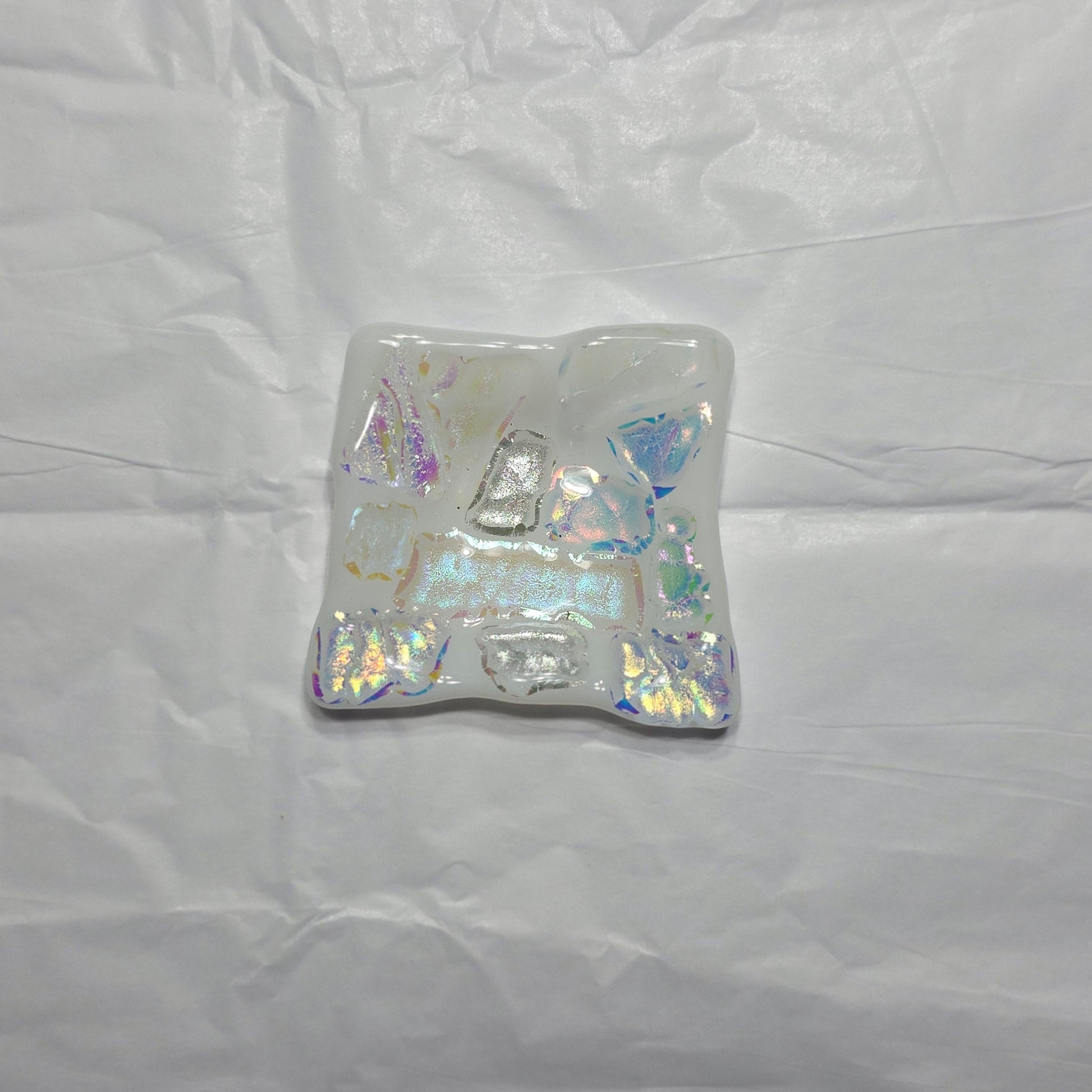 Iridescent decorative dish on a white background