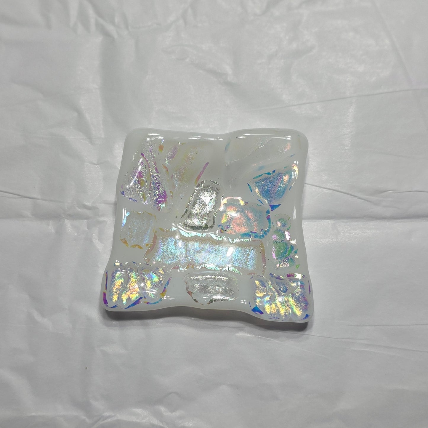 Iridescent square dish on a white background