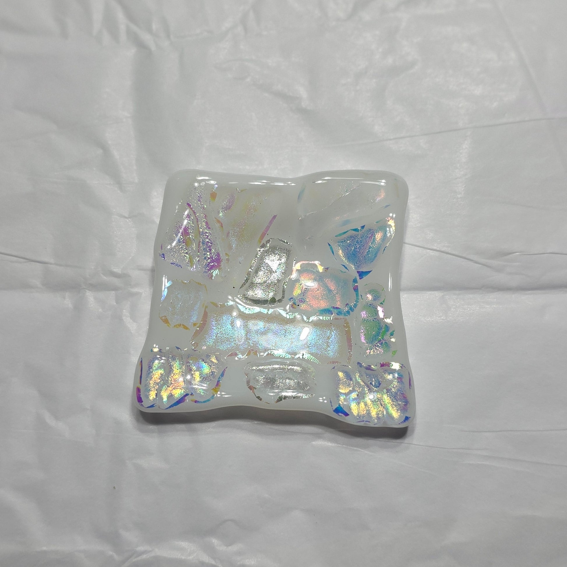 Iridescent square dish on a white background