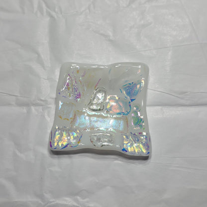 Iridescent square dish on a white background