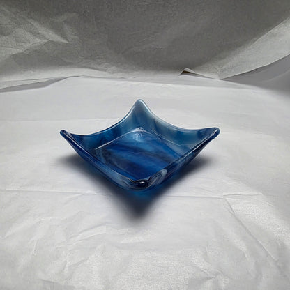 Blue glass dish on a white background