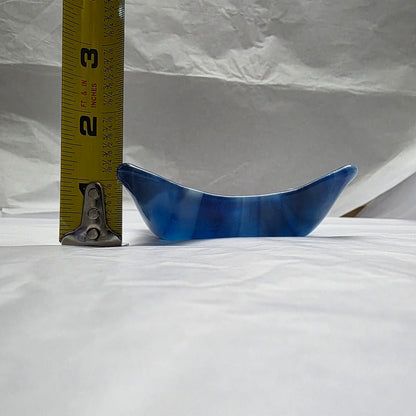 Various blue and white streaky colored little dish next to a tape measure.  Depth approximately 1.5 inches.