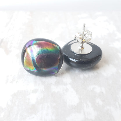Black stud earrings with a rainbow iridescent top and silver plated posts.